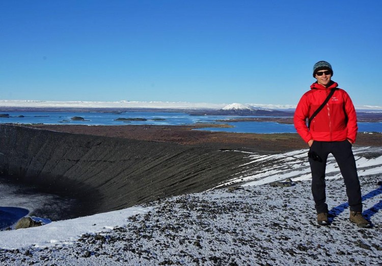 Theron Finley stands near Hverfjall, a cinder cone volcano in northern Iceland located near a geothermal power plant. Finley is travelling around the world to learn how Canada may be able to take advantage of geothermal energy. (Photo: Supplied)