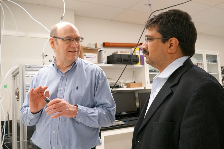Future Energy Systems Director Larry Kostiuk in his lab with Deputy Director Amit Kumar. 