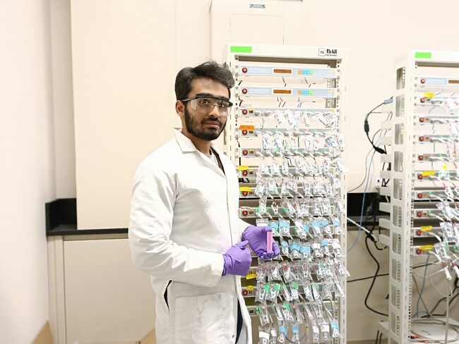 Anil posing with samples